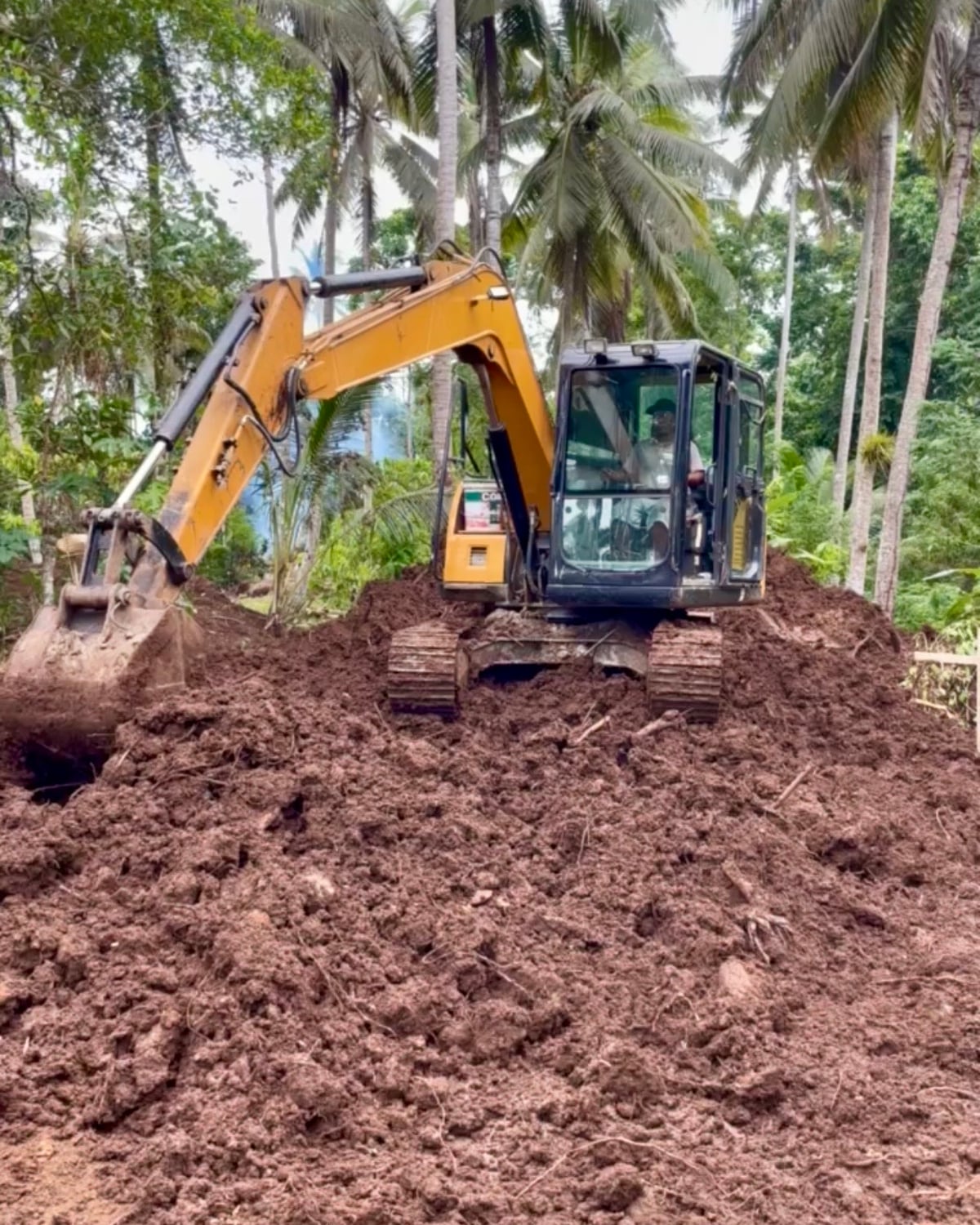 Earthworks excavator on a Nirvana Islands site, Bali / Lombok